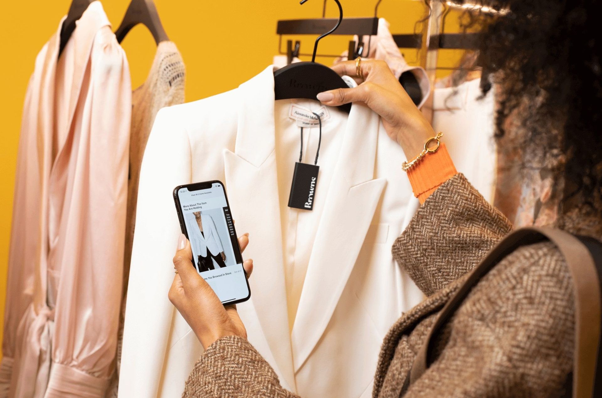 Woman scanning product tags with the mobile app
